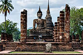 Thailand, Old Sukhothai - Wat Mahathat, the remains of a bot with a large seated Buddha. 